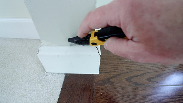 Score Caulking Between Woodwork and Drywall